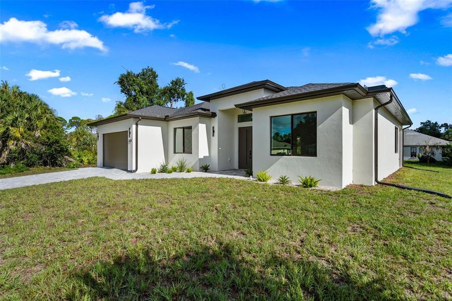 Front exterior of a new home in , North Port, FL, highlighting curb appeal (Image 27).