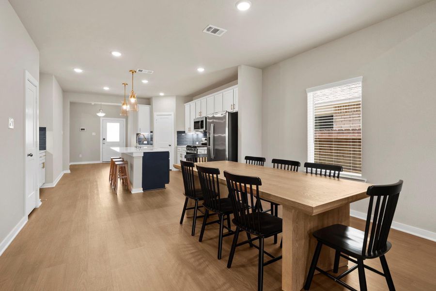 Dining opens to kitchen and living area Dining opens to kitchen and living area