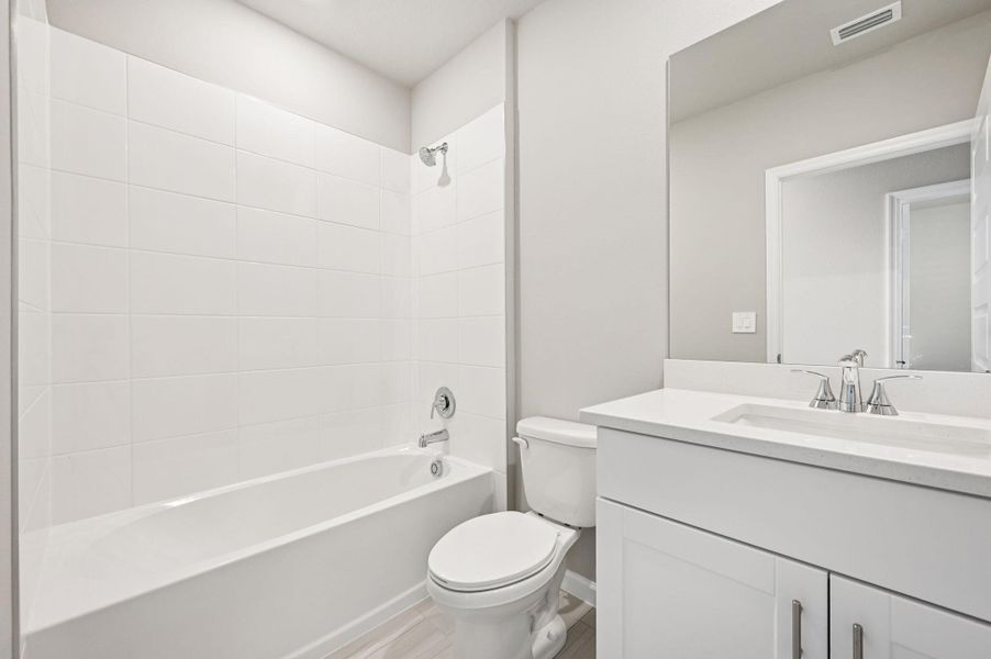 Furnished interior view inside a new home in Hampton Park - Classic Series, Vero Beach (Image 15). Furnished interior view inside a new home in Hampton Park - Classic Series, Vero Beach (Image 15).