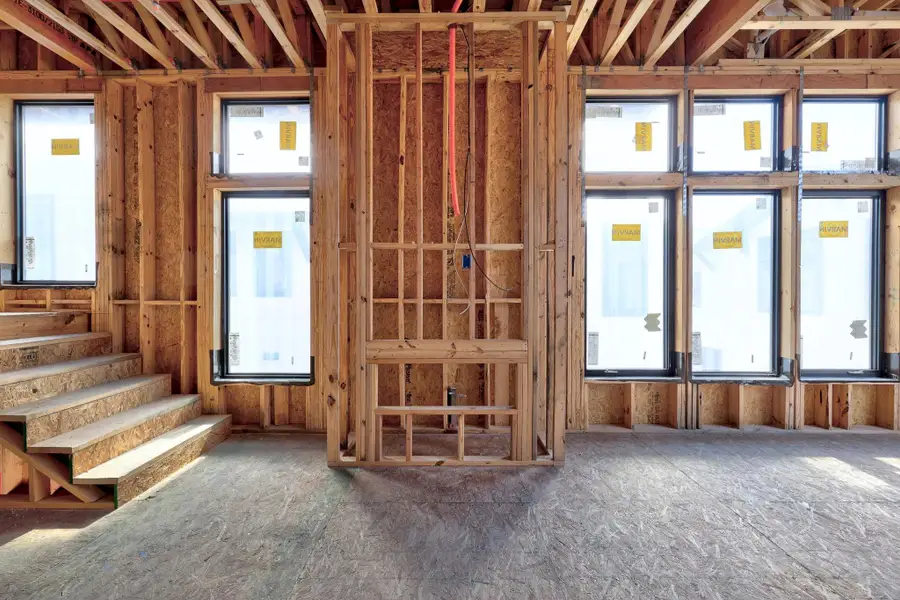 Misc room with plenty of natural light and stairs