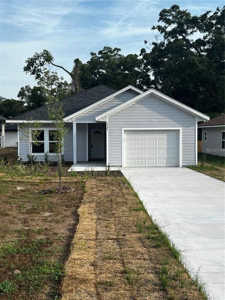Front exterior of a new home in , Alachua, FL, highlighting curb appeal (Image 15).