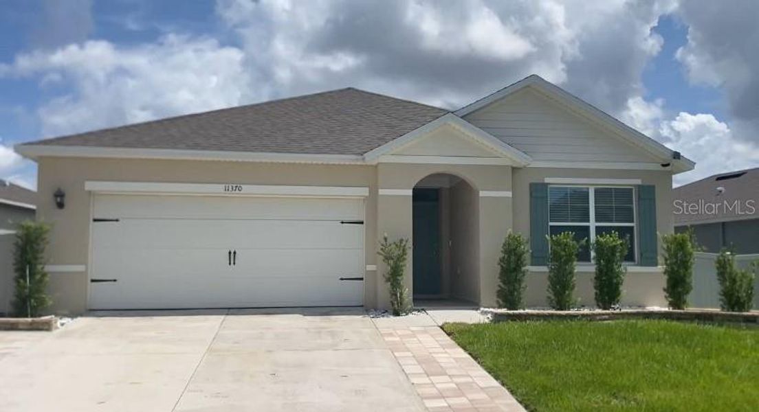 Front exterior of a new home in Westridge Park, Zellwood, FL, highlighting curb appeal (Image 1). Front exterior of a new home in Westridge Park, Zellwood, FL, highlighting curb appeal (Image 1).