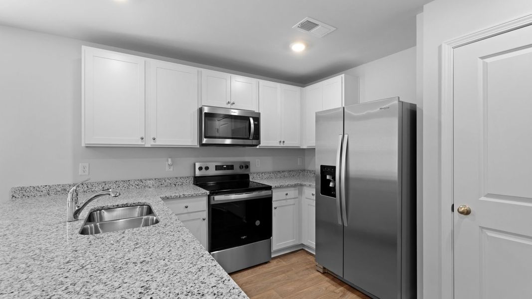 Representative furnished interior of a home built from the HELENA by D.R. Horton in Center Pointe, Santee (Image 5).