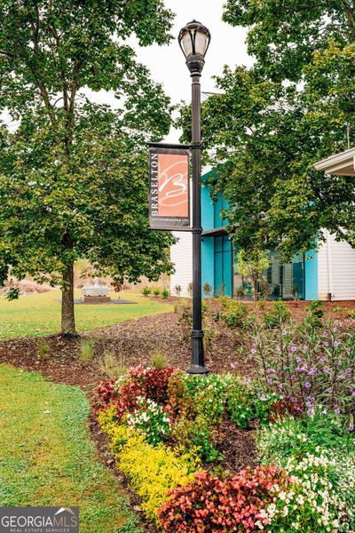 Front exterior of a new home in Rosewood Lake Estates, Hoschton, GA, highlighting curb appeal (Image 29).