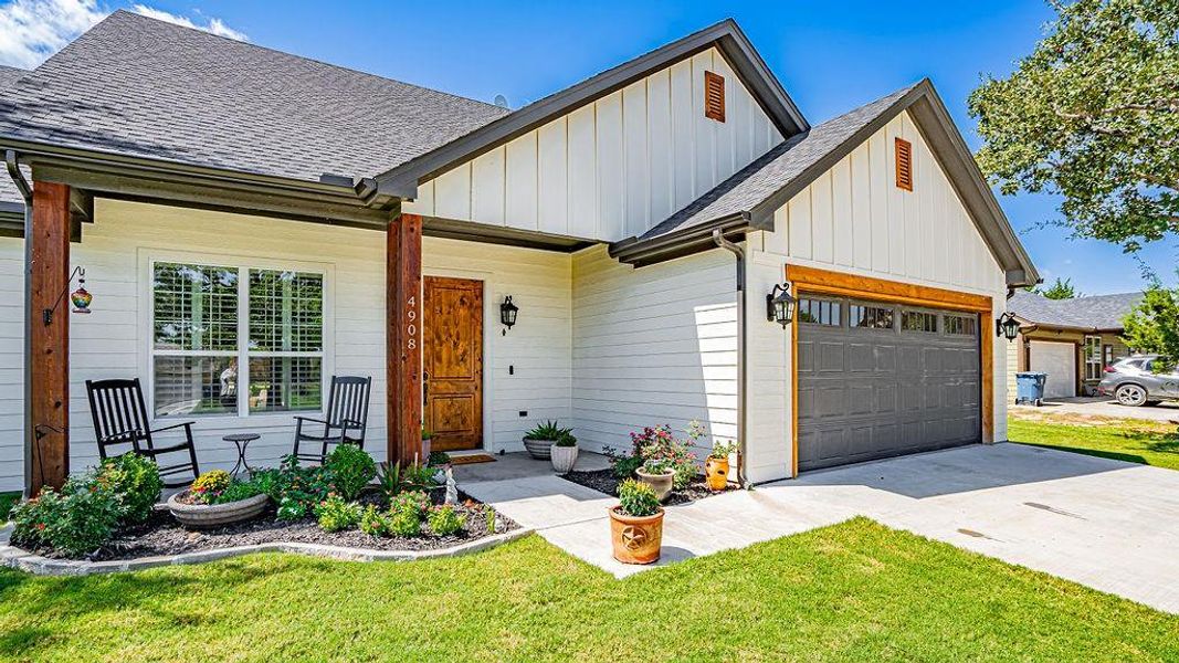 View of front facade with a front yard and a garage