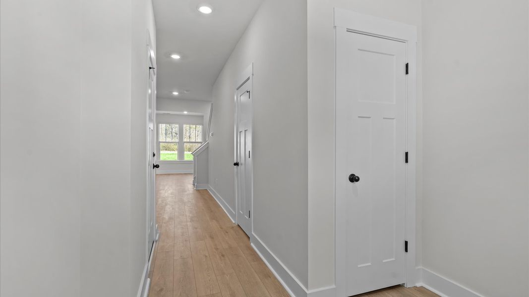 Accomplished hardwood flooring foyer sets the tone for tasteful design throughout the home in Simpsonville, SC