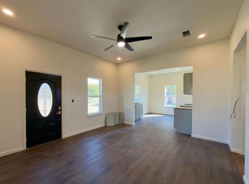Entrance foyer featuring recessed lighting, dark wood-type flooring, and a ceiling fan Entrance foyer featuring recessed lighting, dark wood-type flooring, and a ceiling fan