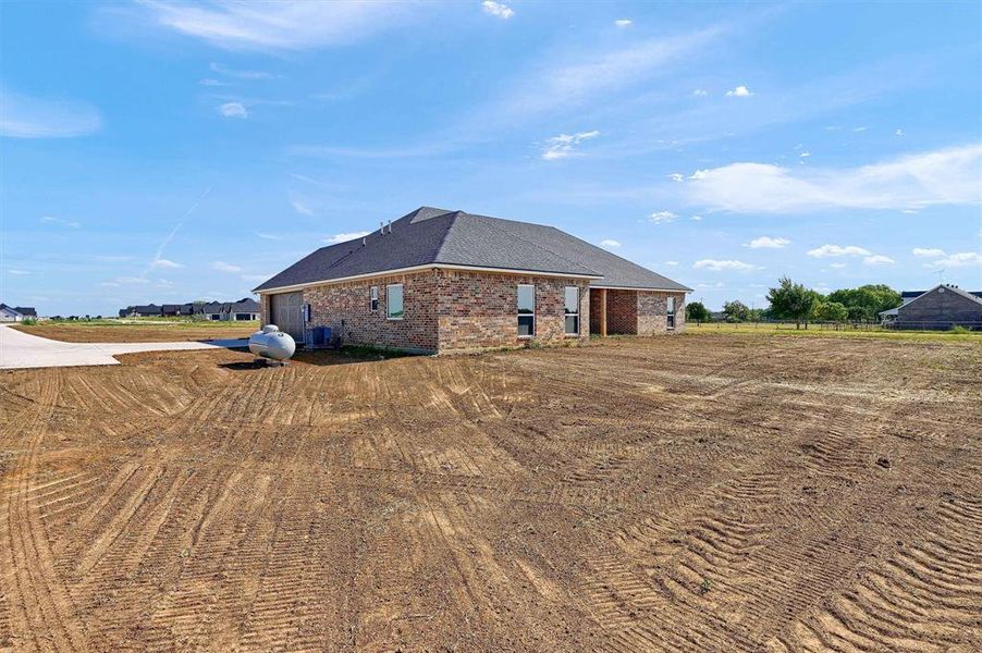 View of home's exterior featuring cooling unit