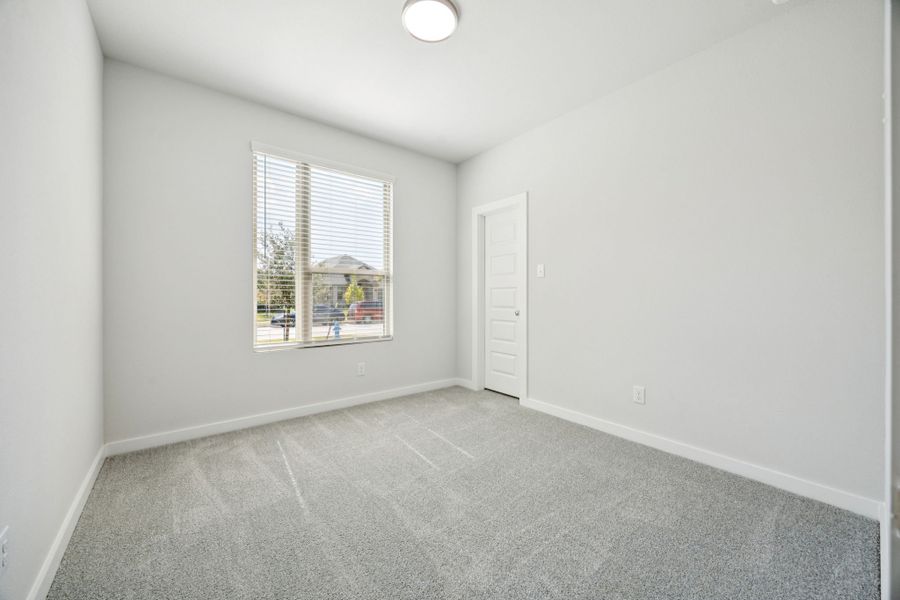 Bedroom in the Emmy II home plan by Trophy Signature Homes - REPRESENTATIVE PHOTO Bedroom in the Emmy II home plan by Trophy Signature Homes - REPRESENTATIVE PHOTO