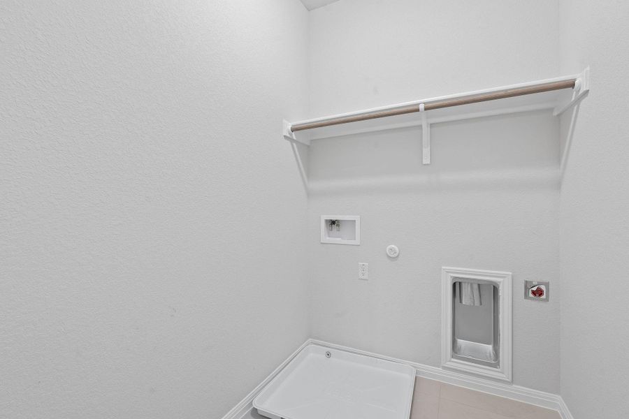 Laundry room with hookup for a gas dryer, washer hookup, and electric dryer hookup