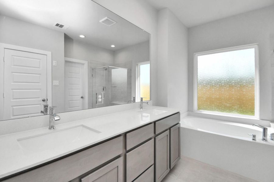 Elevate your daily routine at the elegant vanity, now equipped with double sinks, light countertops, modern hardware, and beautiful recessed lights. Sample photo of completed home with similar floor plan. Actual colors and selections may vary. Elevate your daily routine at the elegant vanity, now equipped with double sinks, light countertops, modern hardware, and beautiful recessed lights. Sample photo of completed home with similar floor plan. Actual colors and selections may vary.