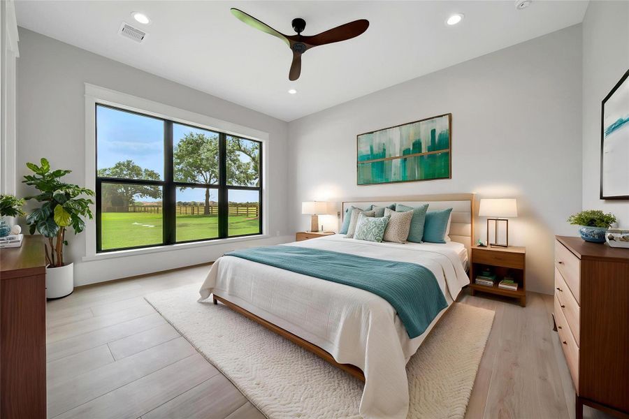 Downstairs Secondary Bedroom looks onto the backyard space.  Large windows let light soak the room.  Place a bird feeder in the garden and beckon nature to your window.