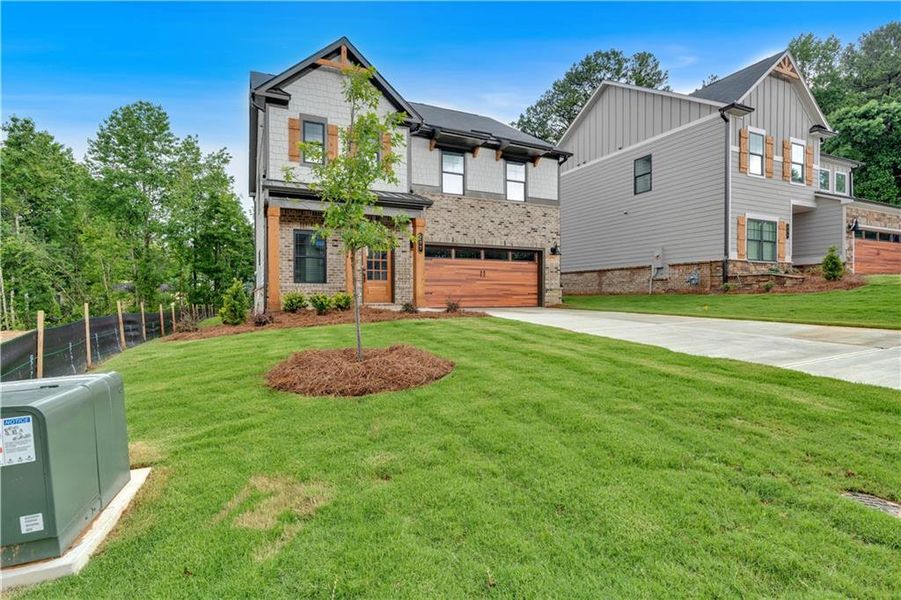Front exterior of a new home in Meadow Pines, Dallas, GA, highlighting curb appeal (Image 15).
