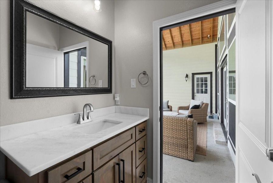 Bathroom off of bedroom #3 with door to back patio.