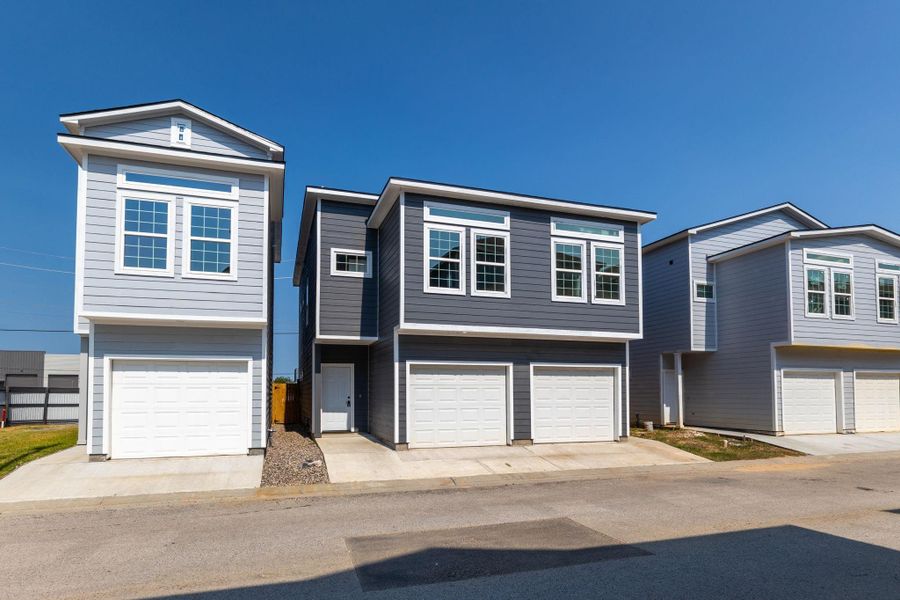 Front exterior of a new home in , Spring, TX, highlighting curb appeal (Image 16). Front exterior of a new home in , Spring, TX, highlighting curb appeal (Image 16).