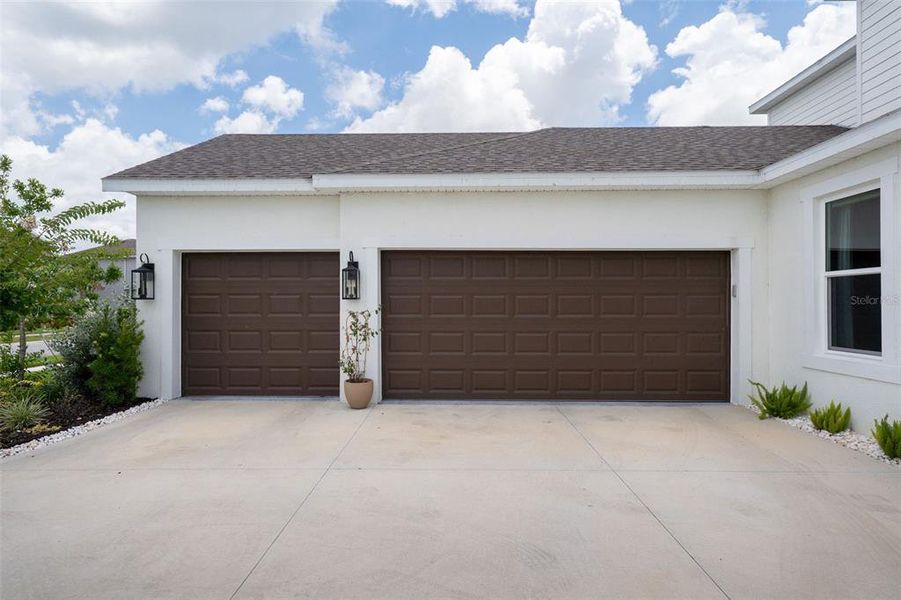 Front exterior of a new home in Skye Ranch Community Group Page, Sarasota, FL, highlighting curb appeal (Image 25).