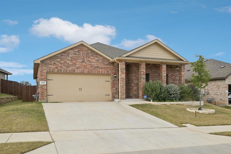 Front exterior of a new home in Springhill South, Boyd, TX, highlighting curb appeal (Image 1). Front exterior of a new home in Springhill South, Boyd, TX, highlighting curb appeal (Image 1).