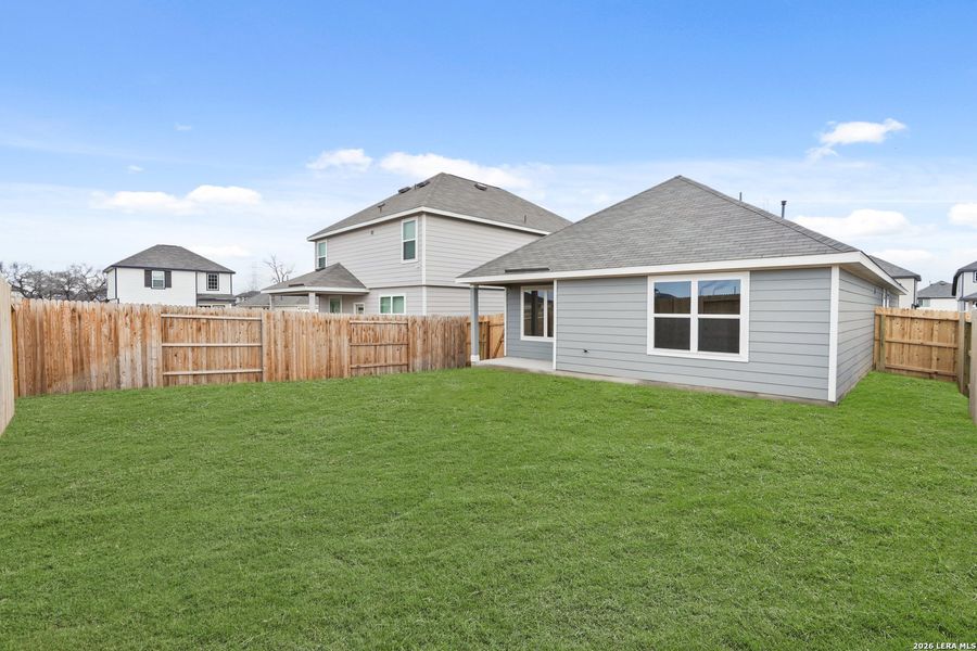 Exterior details and patio area of a home in Hickory Ridge, Elmendorf (Image 17).