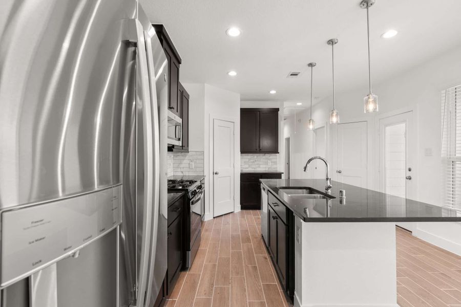 Furnished interior view inside a new home in Meridiana, Manvel (Image 5). Furnished interior view inside a new home in Meridiana, Manvel (Image 5).