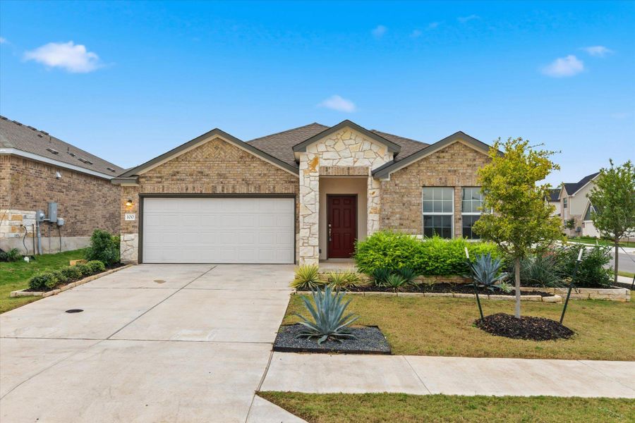 Front exterior of a new home in Thunder Rock: Watermill Collection, Marble Falls, TX, highlighting curb appeal (Image 22).