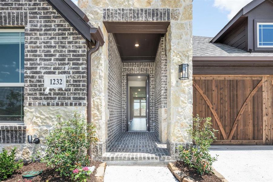 Exterior details and patio area of a home in The Oaks, Red Oak (Image 3). Exterior details and patio area of a home in The Oaks, Red Oak (Image 3).