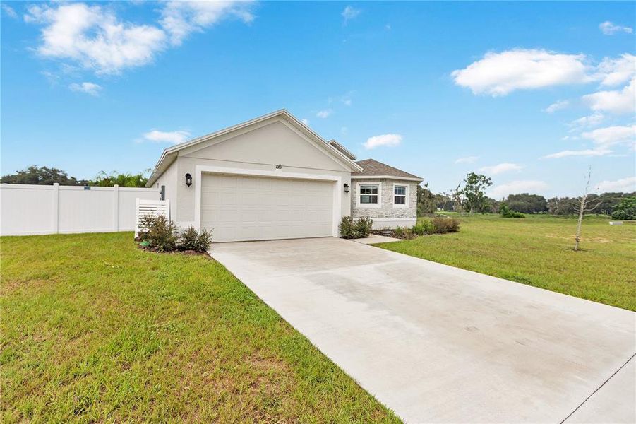Front exterior of a new home in Sand Lake Groves, Bartow, FL, highlighting curb appeal (Image 17). Front exterior of a new home in Sand Lake Groves, Bartow, FL, highlighting curb appeal (Image 17).