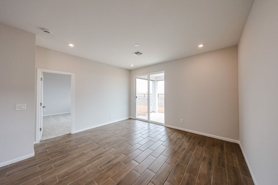 A room with a wood floor and a wood floor.