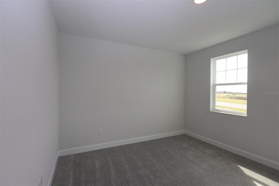 Spacious, unfurnished interior of a new home in Lake Star at Ovation, Winter Garden (Image 38).