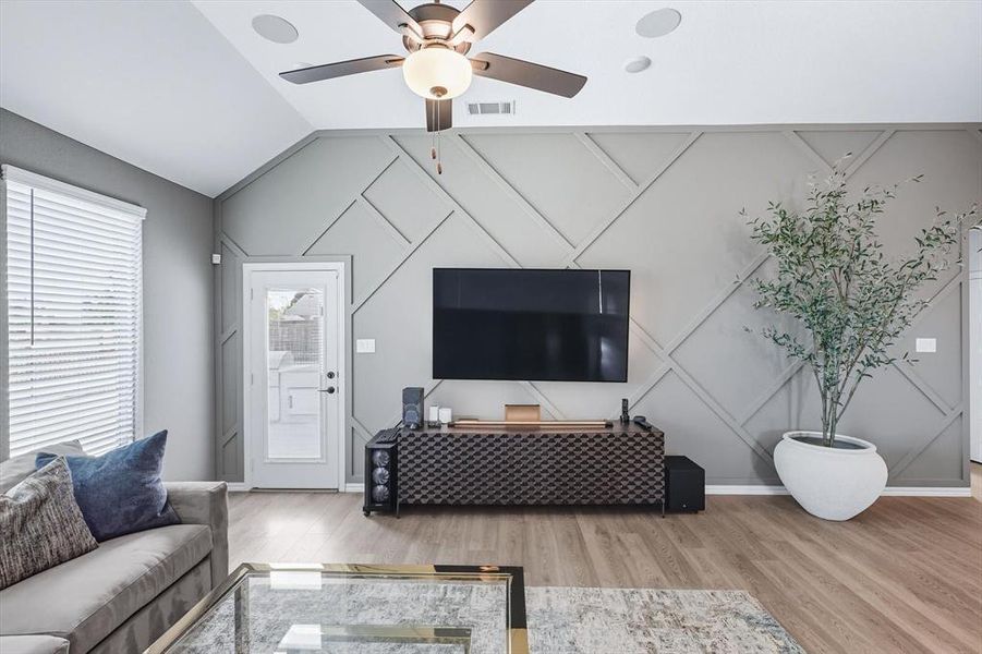 Living room with ceiling fan and wood finished floors