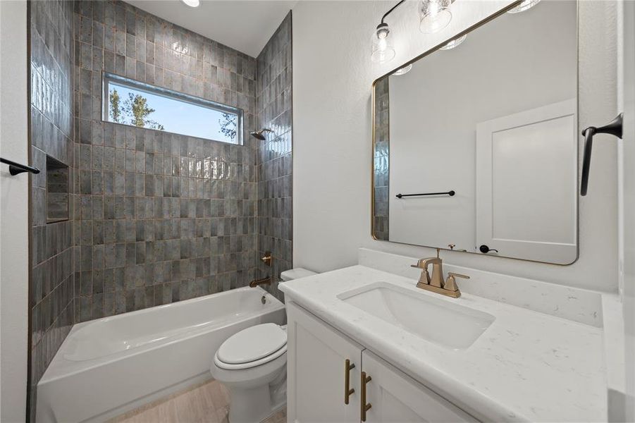 Full bath with bathing tub / shower combination and vanity