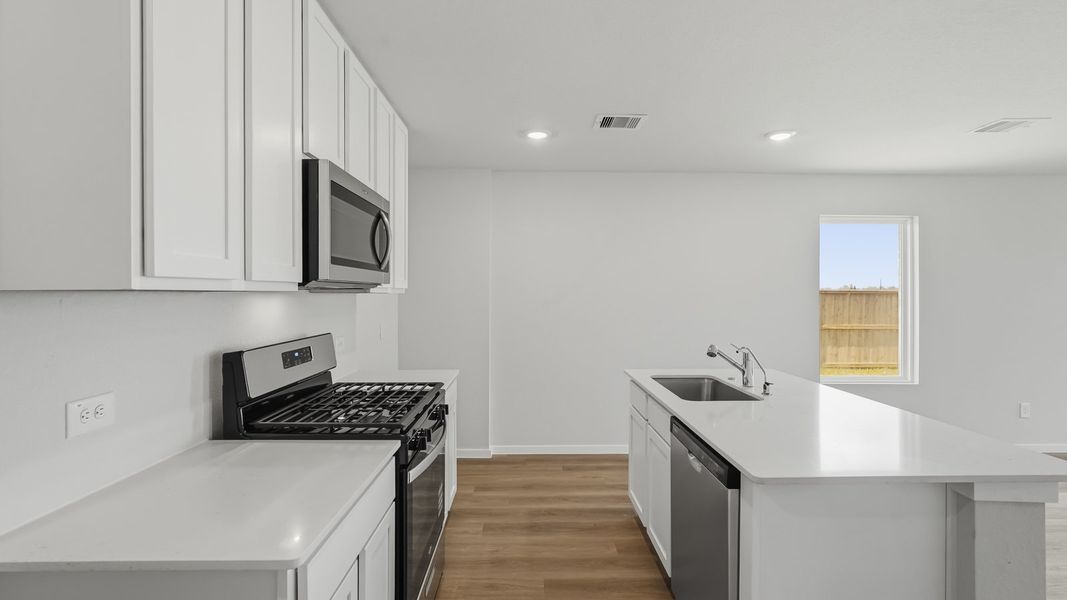 Furnished interior view inside a new home in Sunterra, Katy (Image 6).