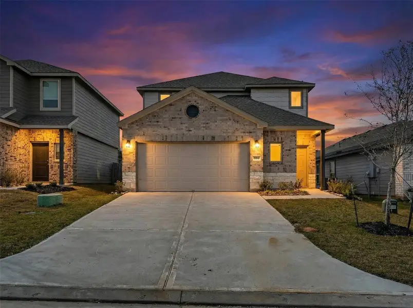 Front exterior of a new home in Chapel Run, Montgomery, TX, highlighting curb appeal (Image 2). Front exterior of a new home in Chapel Run, Montgomery, TX, highlighting curb appeal (Image 2).