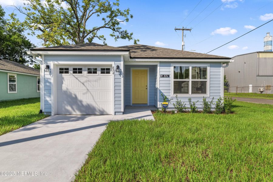 Front exterior of a new home in , Jacksonville, FL, highlighting curb appeal (Image 1).