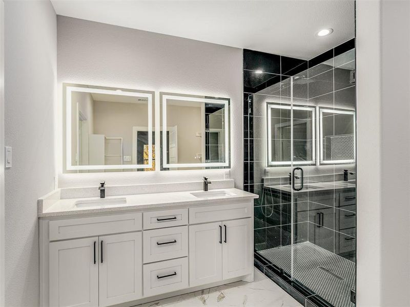 Bathroom featuring vanity and walk in shower