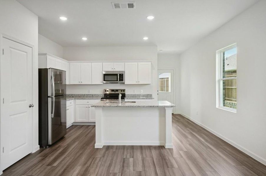 Furnished interior view inside a new home in Vacek Pointe, Richmond (Image 5).
