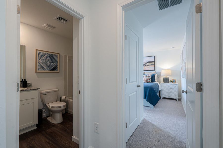 A bathroom with a toilet and a sink.