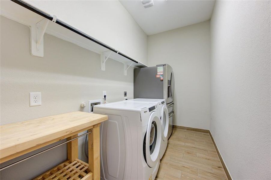 Impressive laundry room with modern amenities and a spacious layou