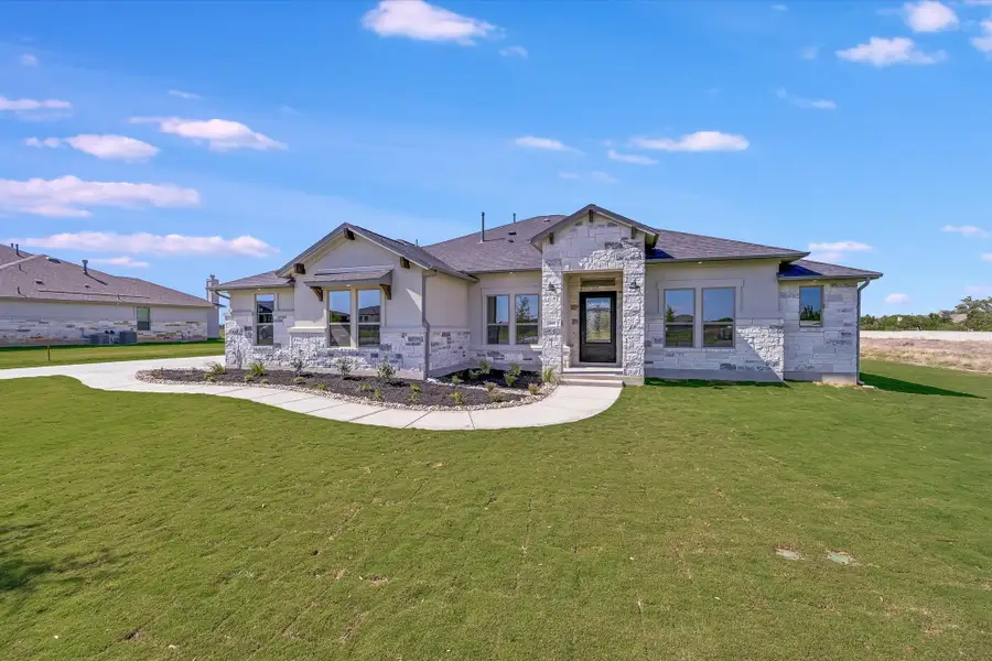 Representative exterior photo of a completed home built from the Llano II by Giddens Homes in Whispering Wind, Bertram, TX (Image 34). Representative exterior photo of a completed home built from the Llano II by Giddens Homes in Whispering Wind, Bertram, TX (Image 34).