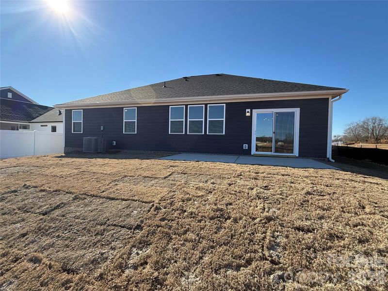 Exterior details and patio area of a home in Wellington Pointe Executive, Monroe (Image 3).