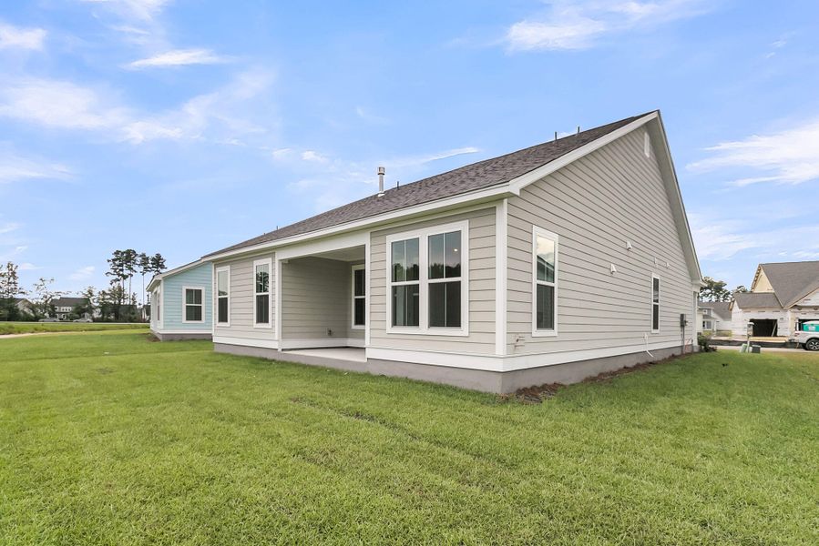 Front exterior of a new home in Tidewater at Lakes of Cane Bay, Summerville, SC, highlighting curb appeal (Image 14).