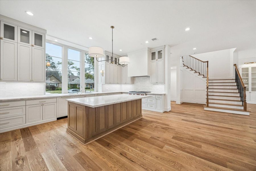 Open Kitchen with Breakfast Bar seating, Large triple Kitchen windows, Quartzite Counters, with open sight lines to Dining and family room! Wonderful entertainment space! Open Kitchen with Breakfast Bar seating, Large triple Kitchen windows, Quartzite Counters, with open sight lines to Dining and family room! Wonderful entertainment space!