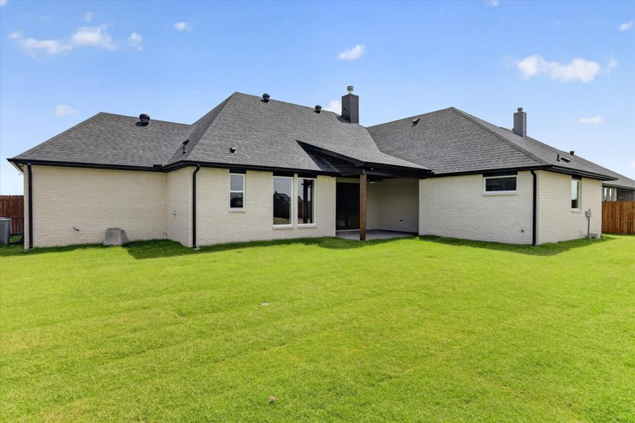 Front exterior of a new home in Coyote Crossing, Godley, TX, highlighting curb appeal (Image 23).