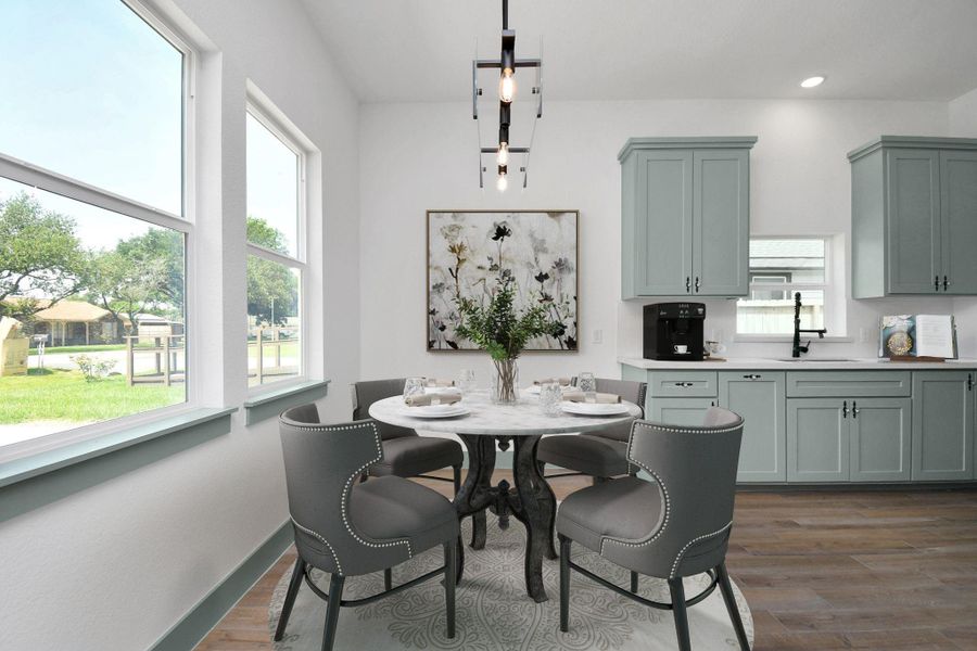 Lovely dining area with a view and plenty of natural light!
