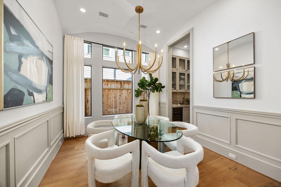 Formal Dining room offers wainscoting, arched ceiling beam detail and large windows. back entry to Butler's Pantry. Formal Dining room offers wainscoting, arched ceiling beam detail and large windows. back entry to Butler's Pantry.