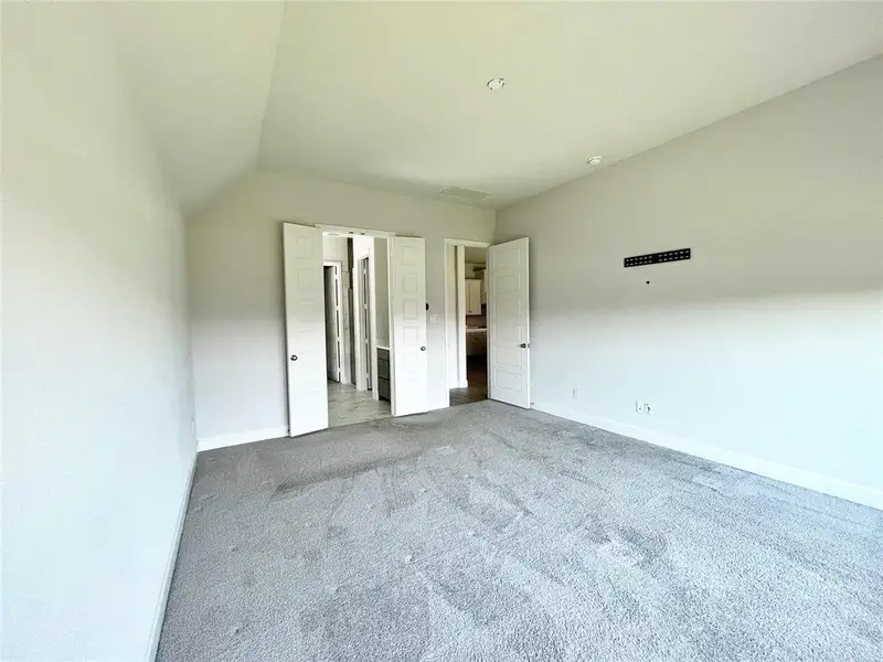 Unfurnished bedroom featuring carpet flooring and baseboards Unfurnished bedroom featuring carpet flooring and baseboards