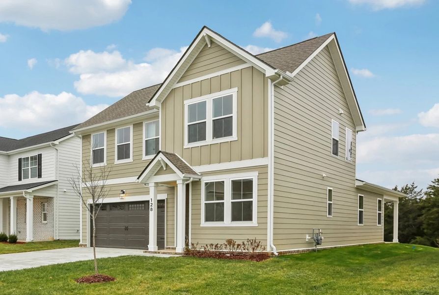 Front exterior of a new home in Ascent at Arbor Ridge, La Vergne, TN, highlighting curb appeal (Image 2). Front exterior of a new home in Ascent at Arbor Ridge, La Vergne, TN, highlighting curb appeal (Image 2).