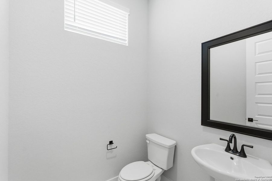 Furnished interior view inside a new home in Potranco Oaks, Castroville (Image 12).