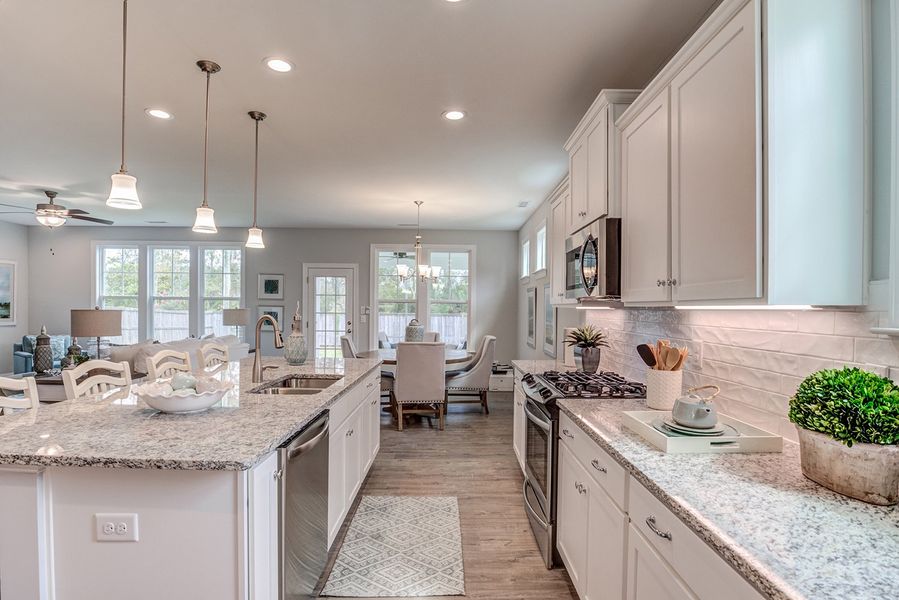 Representative furnished interior of a home built from the The Amherst by RobuckHomes in Windwater, Hampstead (Image 10).