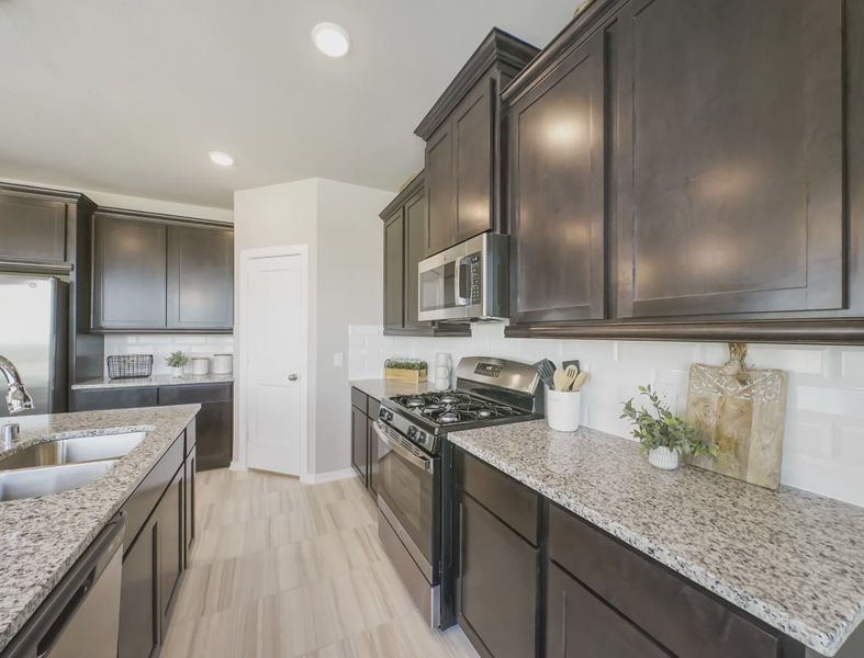 Representative furnished interior of a home built from the Springfield by Chesmar Homes in Sienna Courtyard, Missouri City (Image 8).