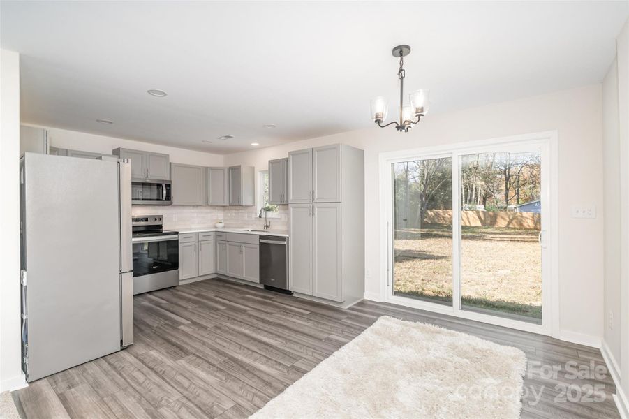 Bright and welcoming! Sliding glass doors open to your backyard oasis - perfect for indoor-outdoor living. Bright and welcoming! Sliding glass doors open to your backyard oasis - perfect for indoor-outdoor living.